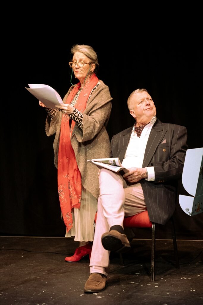 Two actors rehearsing a play on stage