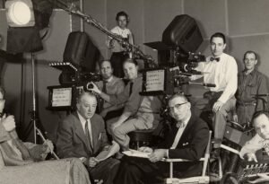 A historical film crew working on a sound stage